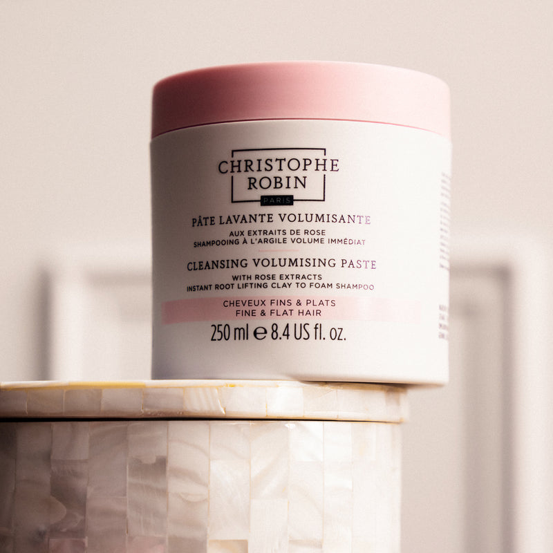 Cleansing Volumising Paste container by Christophe Robin on a neutral background