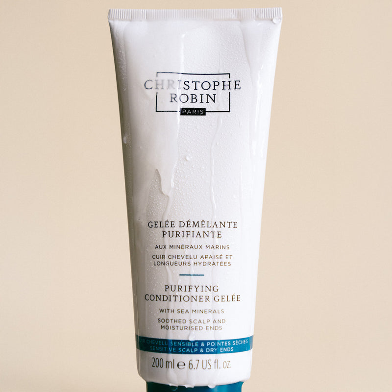 Tube of Christophe Robin Purifying Conditioner Gelee on a beige background