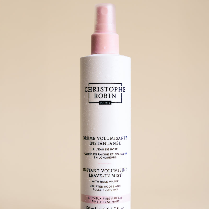 Christophe Robin hair mist bottle on a beige background