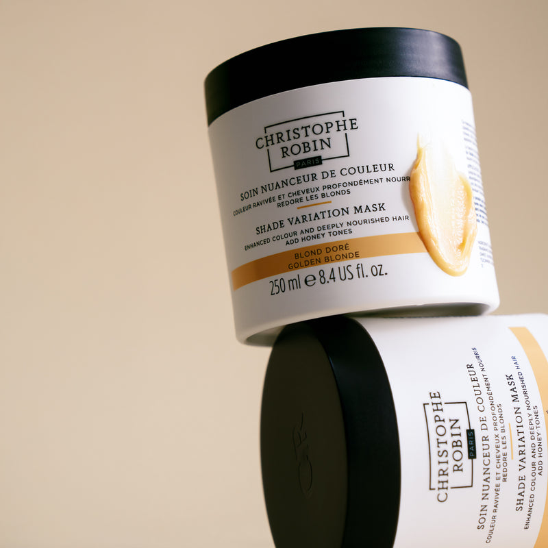 Christophe Robin Shade Variation Masks in golden blonde showing texture on beige background 
