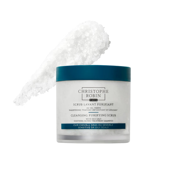 Cleansing purifying scrub container with blue lid showing product texture on a white background