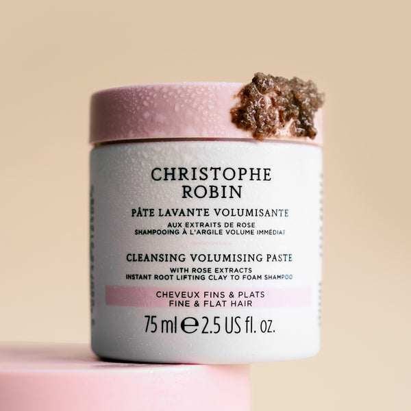 Cleansing volumising paste 75ml jar with Christophe Robin branding showing texture on a beige background