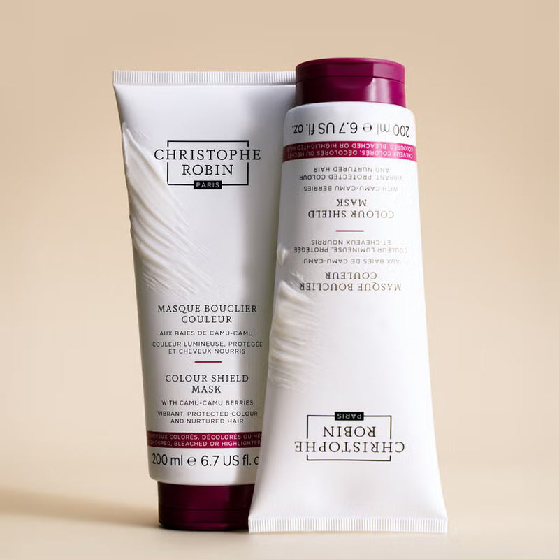 Two hair care products from Christophe Robin on a beige background