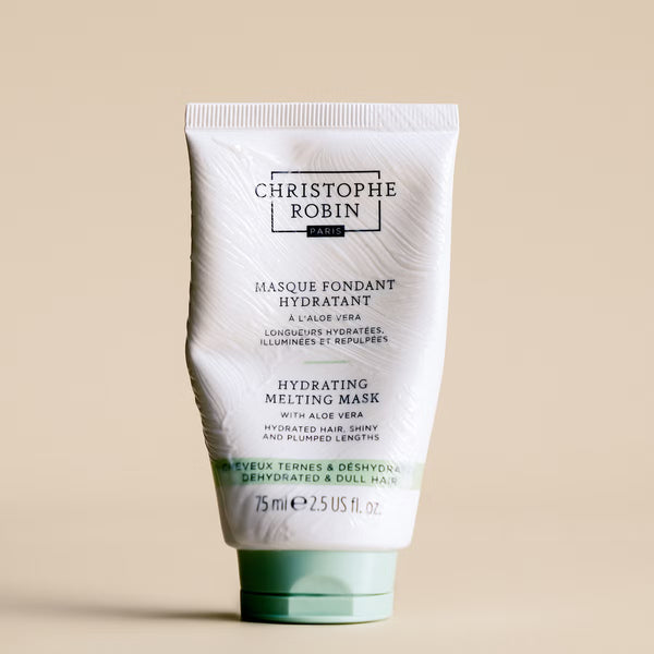 Tube of Christophe Robin hydrating melting mask 75ml on a beige background