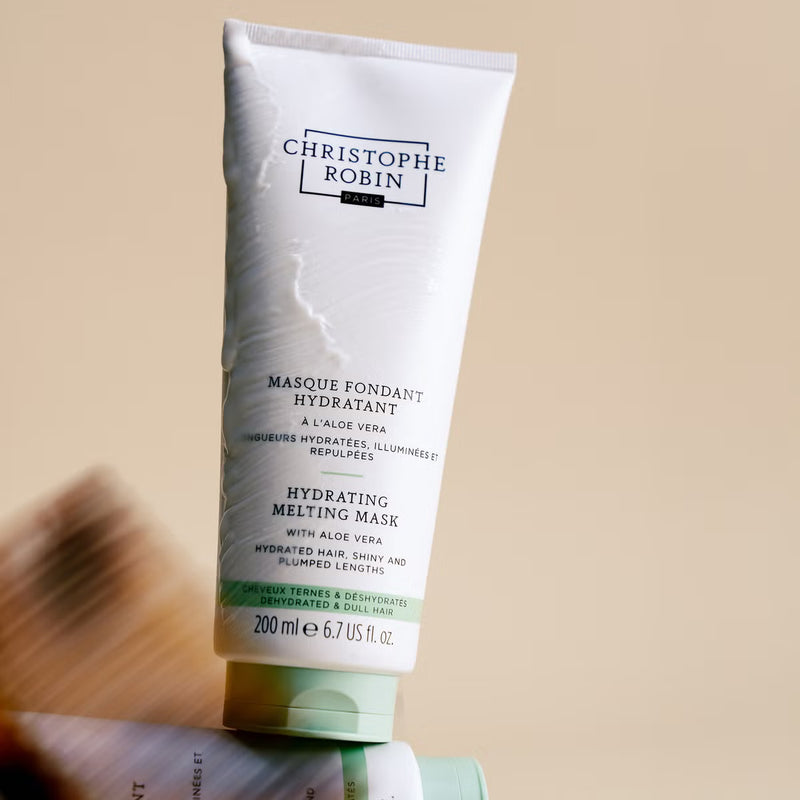 Tube of Christophe Robin hydrating melting mask on a beige background