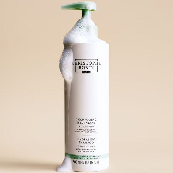 Hydrating shampoo bottle 500ml with green pump on beige background