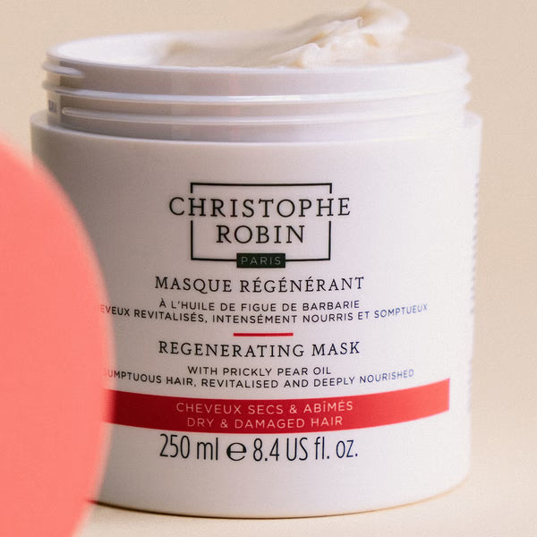 Christophe Robin regenerating mask open jar showing texture with visible text on a beige background