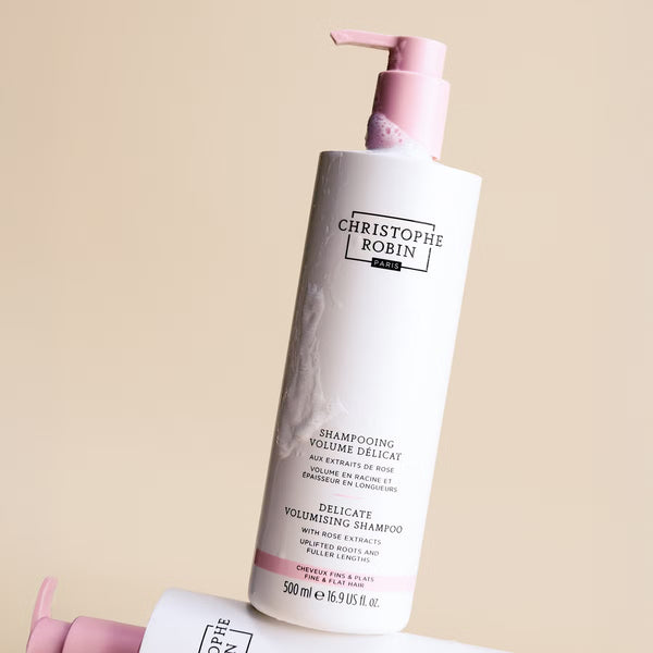 Christophe Robin Delicate Volumising shampoo 500ml with pump on a beige background